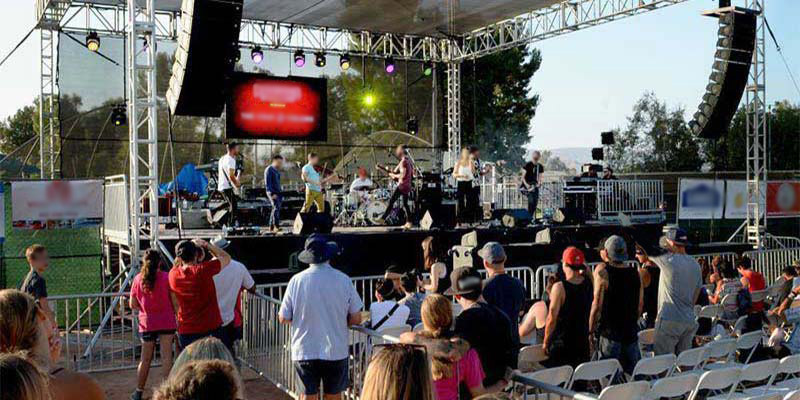 Fans watching a music performance around our event rentals for concerts near Carpinteria, California.