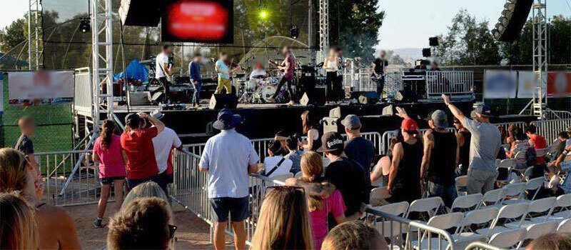 Temporary fencing near San Luis Obispo for an outdoor concert.